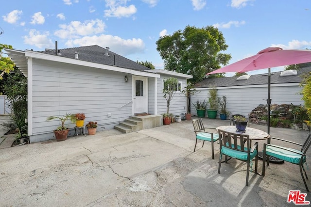 back of property featuring a patio