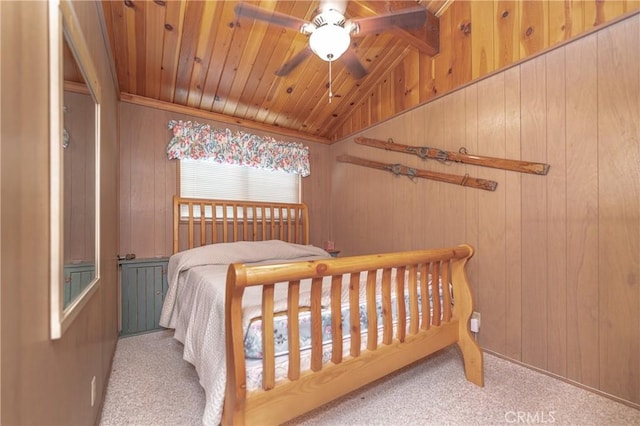 bedroom with light colored carpet, ceiling fan, wood walls, and wood ceiling