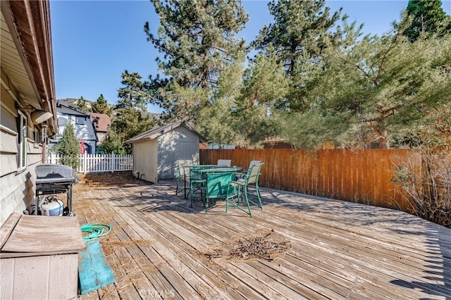 wooden terrace featuring a grill