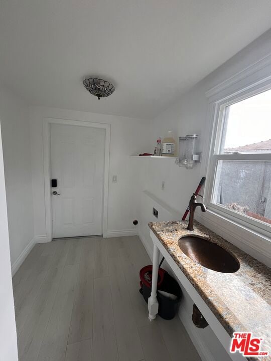 bathroom with sink and hardwood / wood-style flooring