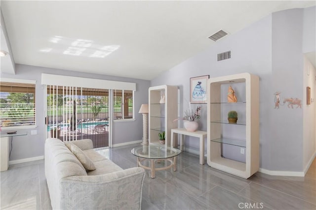 living area with lofted ceiling