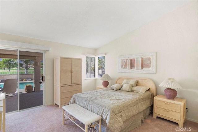 carpeted bedroom featuring access to exterior and vaulted ceiling