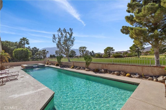 view of pool featuring a mountain view and a patio area