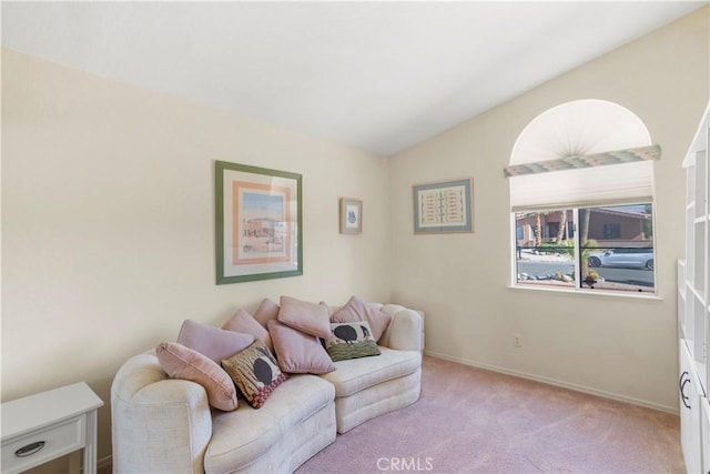 carpeted living room with lofted ceiling