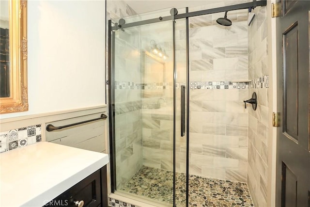 bathroom featuring a shower with shower door