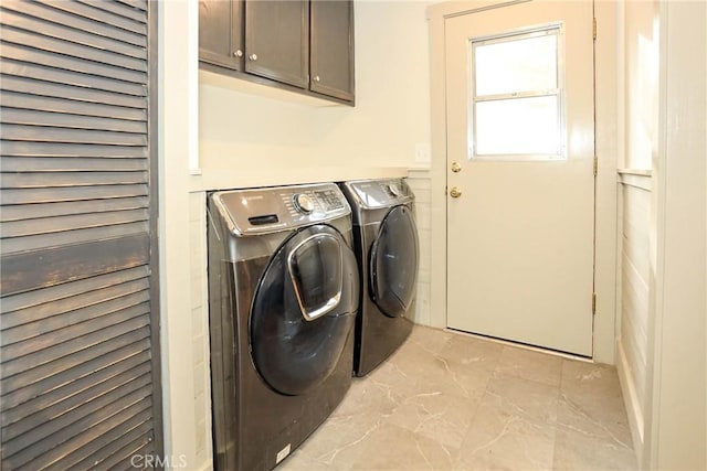 laundry area featuring cabinets and washer and dryer