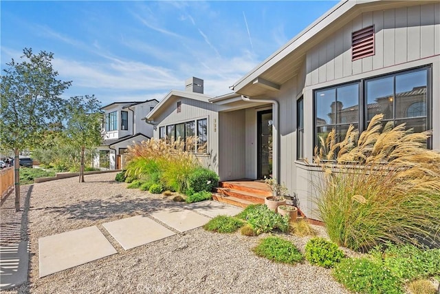 337 Holmwood Dr, Newport Beach, CA 92663 - property entrance with a chimney