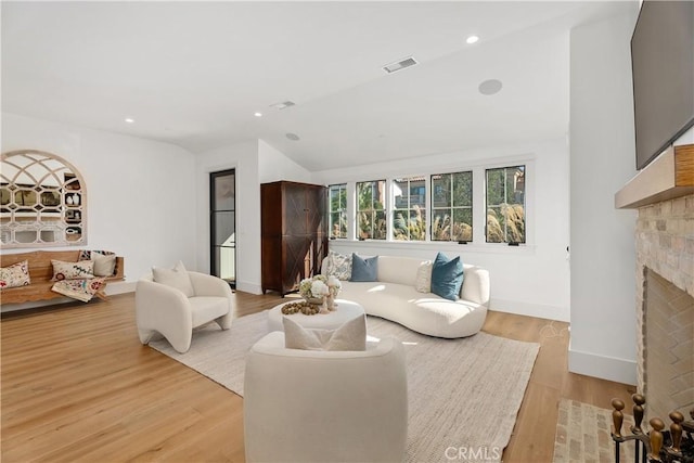337 Holmwood Dr, Newport Beach, CA 92663 - living area featuring vaulted ceiling, a brick fireplace, light wood-type flooring, and recessed lighting