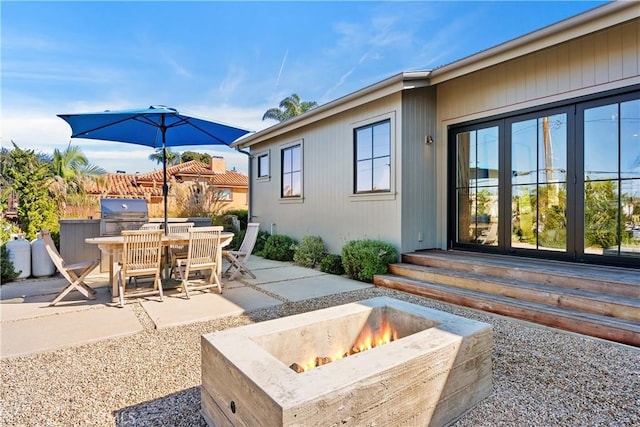 337 Holmwood Dr, Newport Beach, CA 92663 - view of patio featuring an outdoor fire pit, french doors, area for grilling, and outdoor dining area