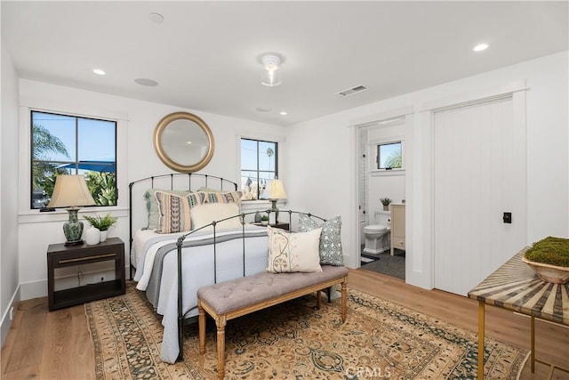 337 Holmwood Dr, Newport Beach, CA 92663 - bedroom with wood finished floors, recessed lighting, and ensuite bathroom
