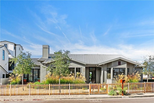337 Holmwood Dr, Newport Beach, CA 92663 - view of front of home with a fenced front yard and a chimney