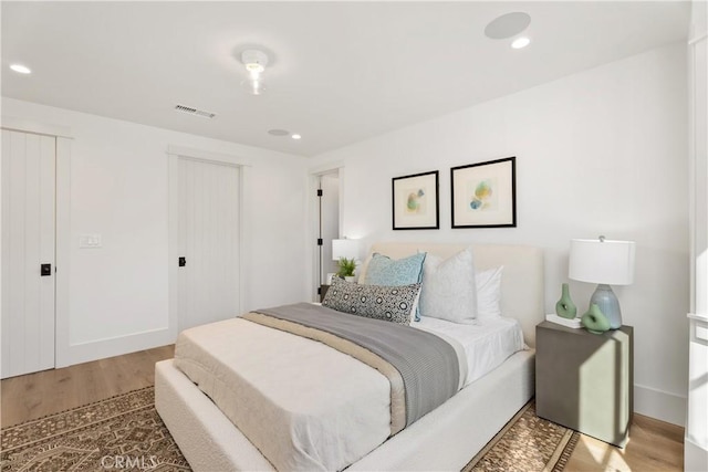 337 Holmwood Dr, Newport Beach, CA 92663 - bedroom with wood finished floors, a closet, and recessed lighting