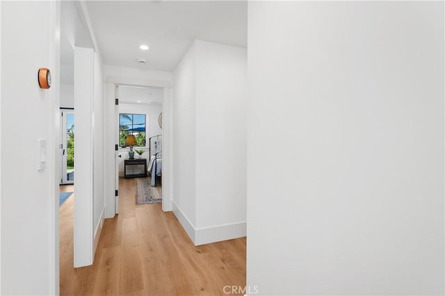 hall with light hardwood / wood-style floors