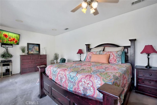 bedroom featuring light carpet and ceiling fan