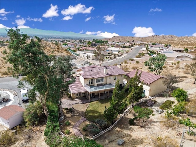 birds eye view of property featuring a mountain view