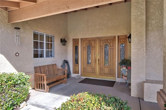 doorway to property with covered porch