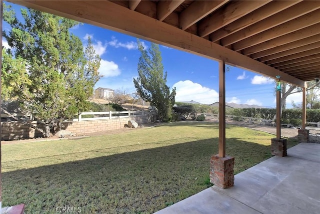 view of yard with a mountain view and a patio