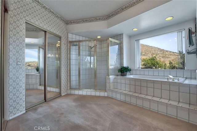 bathroom featuring a mountain view and independent shower and bath