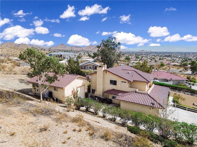 birds eye view of property featuring a mountain view