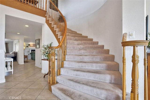 staircase featuring tile patterned flooring