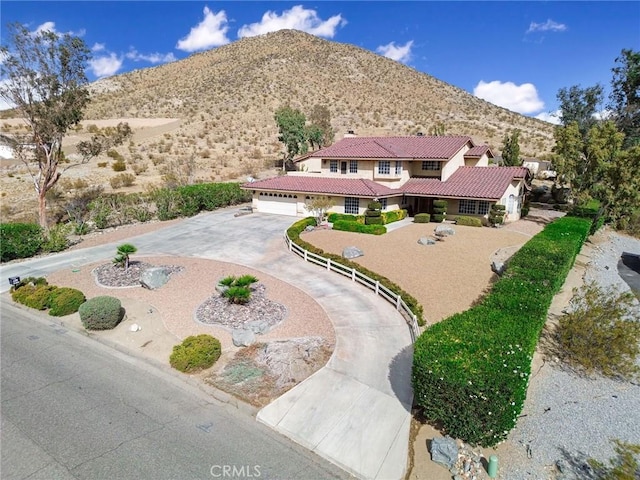 view of front of house featuring a mountain view and a garage