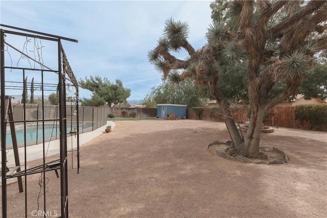 view of yard featuring a fenced in pool