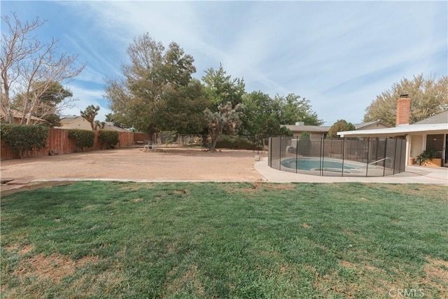 view of yard featuring a fenced in pool and a patio area