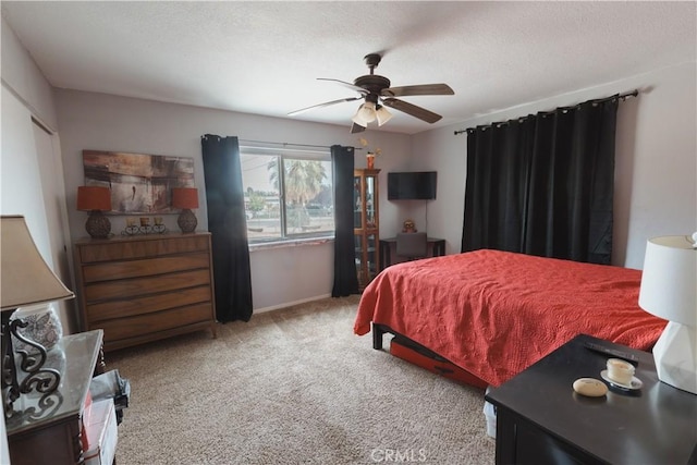 bedroom featuring ceiling fan and light colored carpet