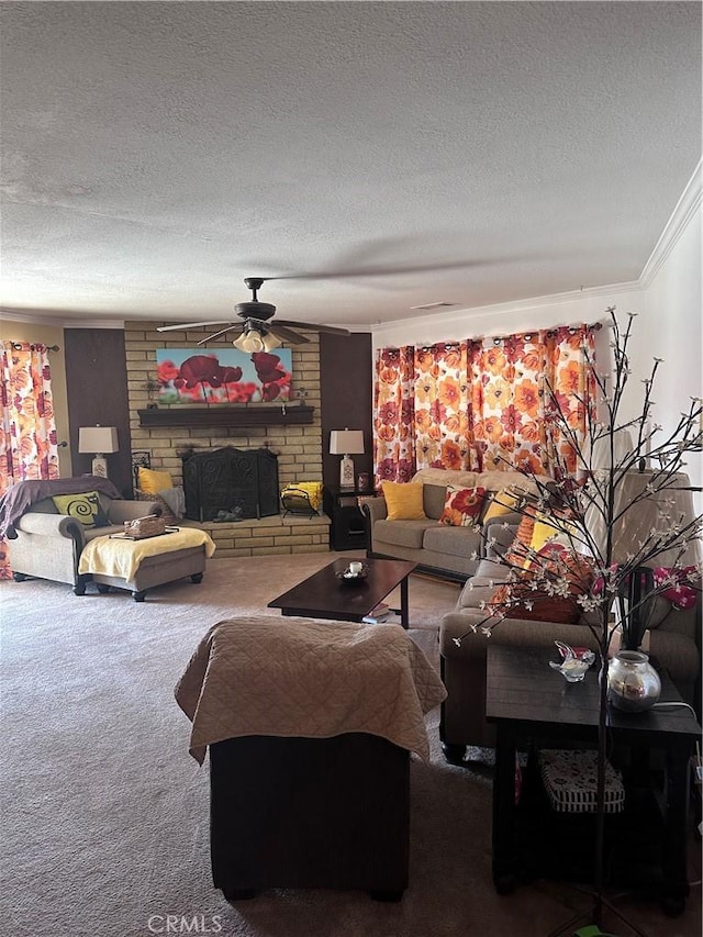 carpeted living room featuring crown molding, ceiling fan, a textured ceiling, and a fireplace