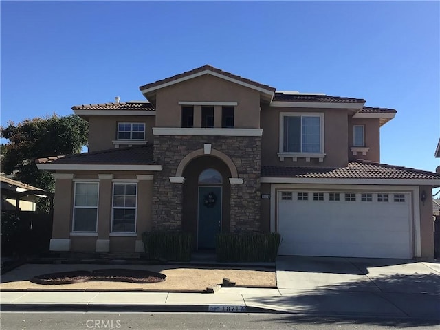 view of front of property with a garage