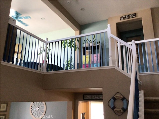 stairs with beamed ceiling