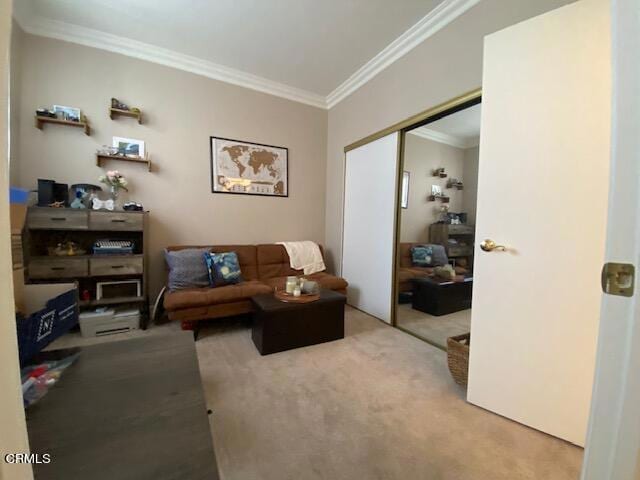 carpeted living room with ornamental molding