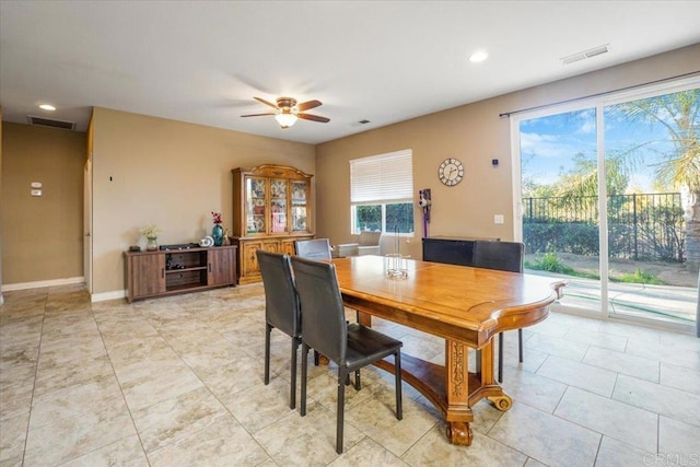 dining space featuring ceiling fan, light tile patterned flooring, visible vents, and baseboards