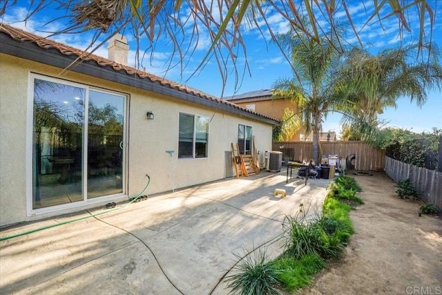 31616 Umbria Ln, Winchester, CA 92596 - back of house with a patio area, stucco siding, a fenced backyard, and central air condition unit