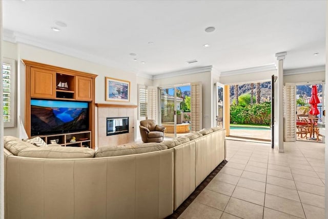 tiled living room featuring a fireplace and ornamental molding