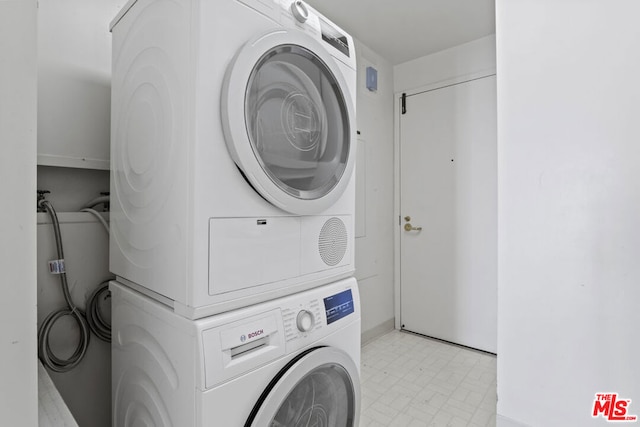 washroom with stacked washer / drying machine