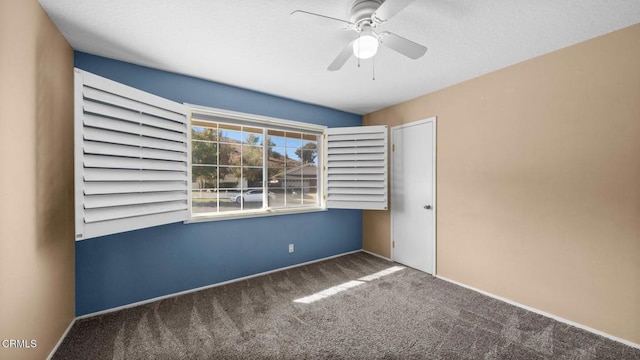 unfurnished bedroom featuring carpet flooring and ceiling fan