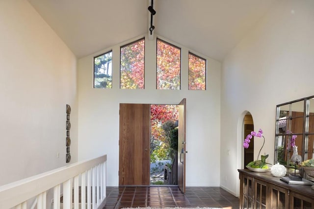 entrance foyer with high vaulted ceiling