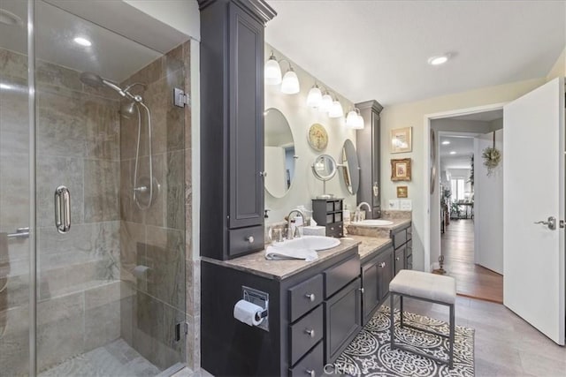 10409 Riverside Dr Unit 204, Toluca Lake, CA 91602 - full bathroom featuring double vanity, a shower stall, and a sink