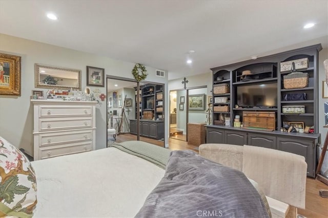 10409 Riverside Dr Unit 204, Toluca Lake, CA 91602 - bedroom with visible vents, recessed lighting, and wood finished floors