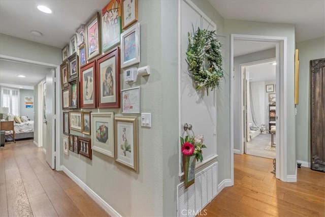 10409 Riverside Dr Unit 204, Toluca Lake, CA 91602 - corridor featuring recessed lighting, light wood-style flooring, visible vents, and baseboards
