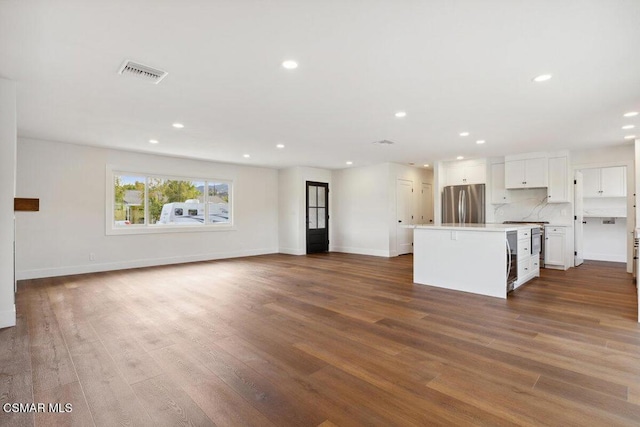 unfurnished living room with hardwood / wood-style floors