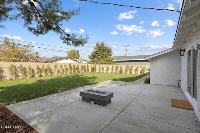 view of patio / terrace with an outdoor fire pit