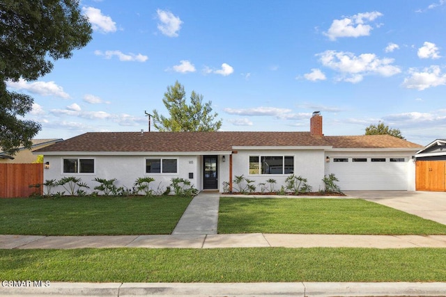 single story home featuring a front yard and a garage