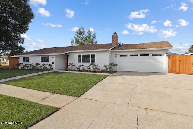 single story home featuring a garage and a front lawn