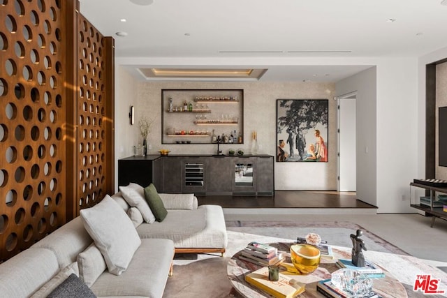 living room featuring wine cooler and indoor bar