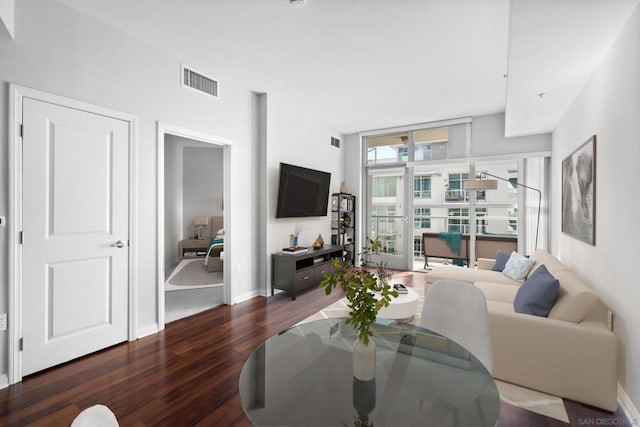 living room featuring dark wood-type flooring