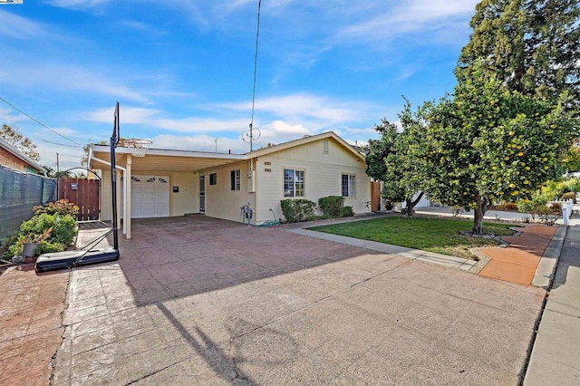 view of front of house with a front lawn and a carport