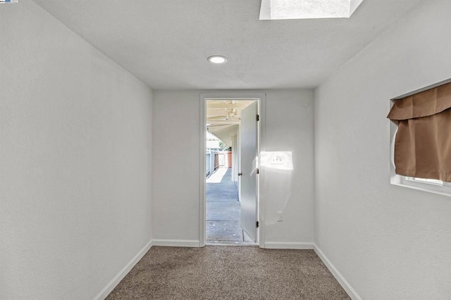 hallway with carpet floors