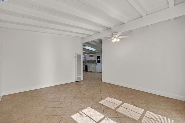 spare room with vaulted ceiling with beams, ceiling fan, and light tile patterned flooring